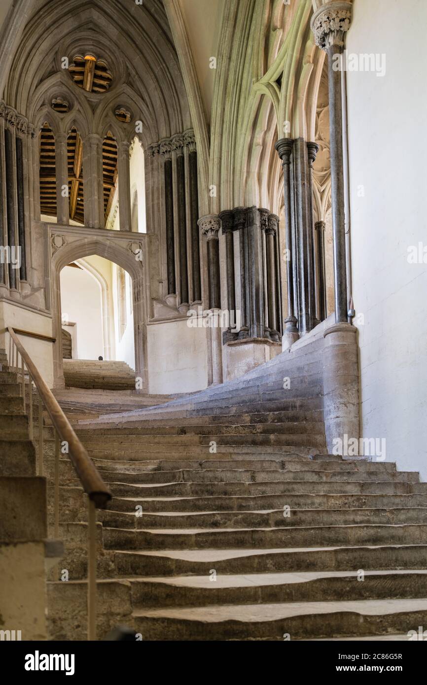 Worn steps stairs staircase Chapter House interior 14th century Wells Cathedral Somerset England UK United Kingdom GB Stock Photo