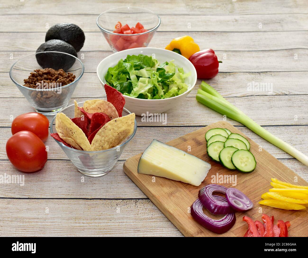 Healthy wholesome ingredients set out ready to prepare meal kit family dinner of gourmet taco salad with fresh harvested vegetables Stock Photo