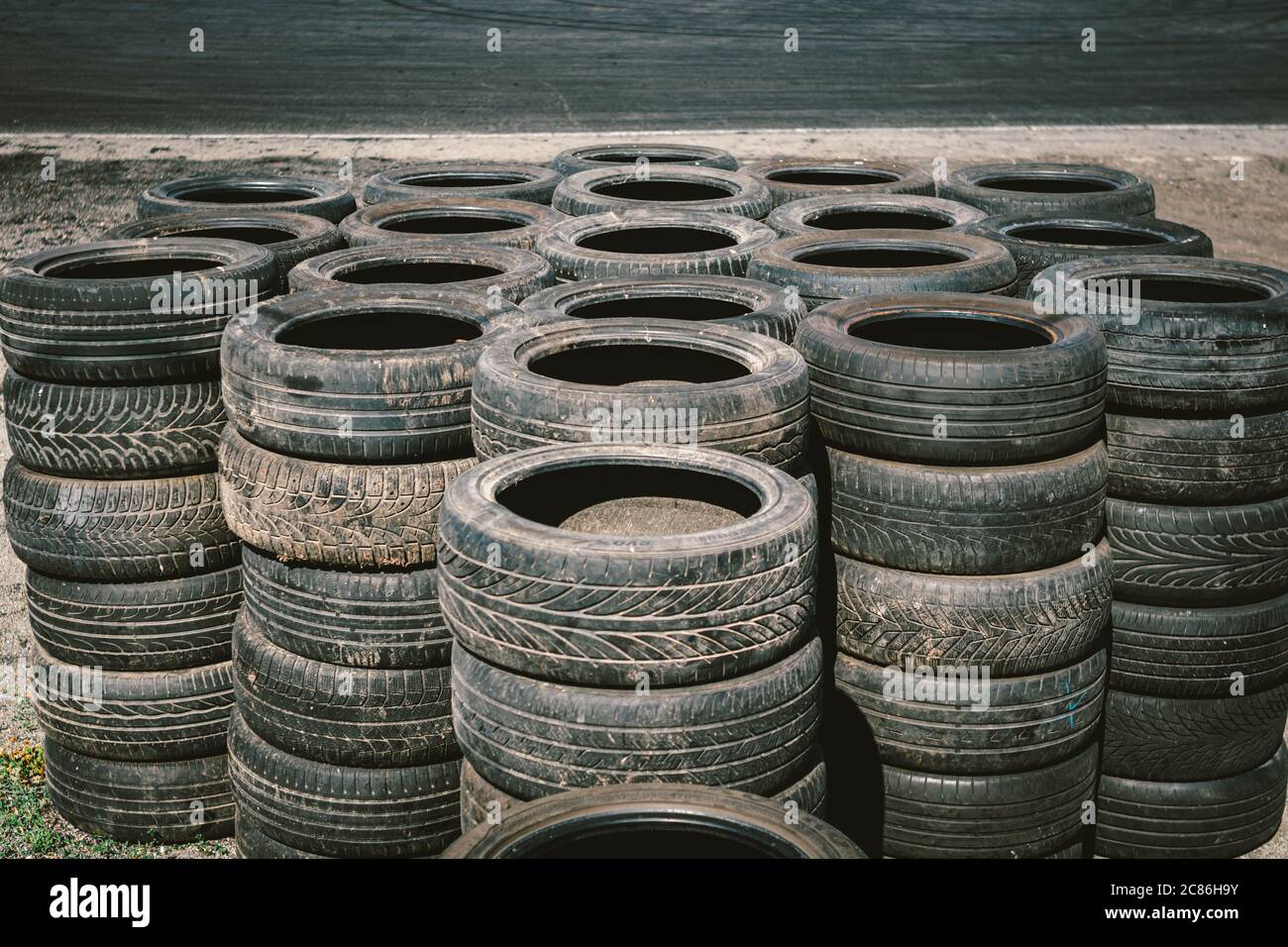 Many Old Used Car Tires Stacked On Top Of Each Other On Automobile Sports Complex Industrial Landfill For The Processing Of Waste Tires And Rubber Stock Photo Alamy