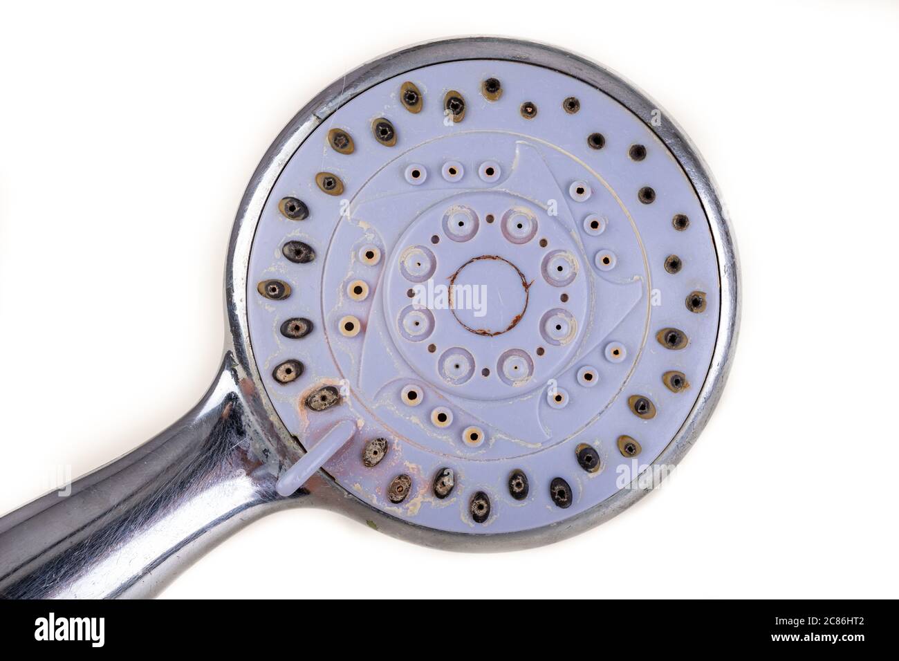Old dirty shower head. Strong dirt in the home bathroom. Light