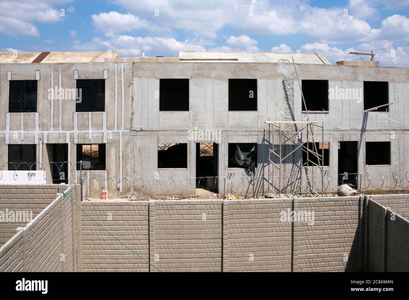 Construction of houses in series, anti seismic architecture in Guatemala, Central  America, cast concrete in situ Stock Photo - Alamy