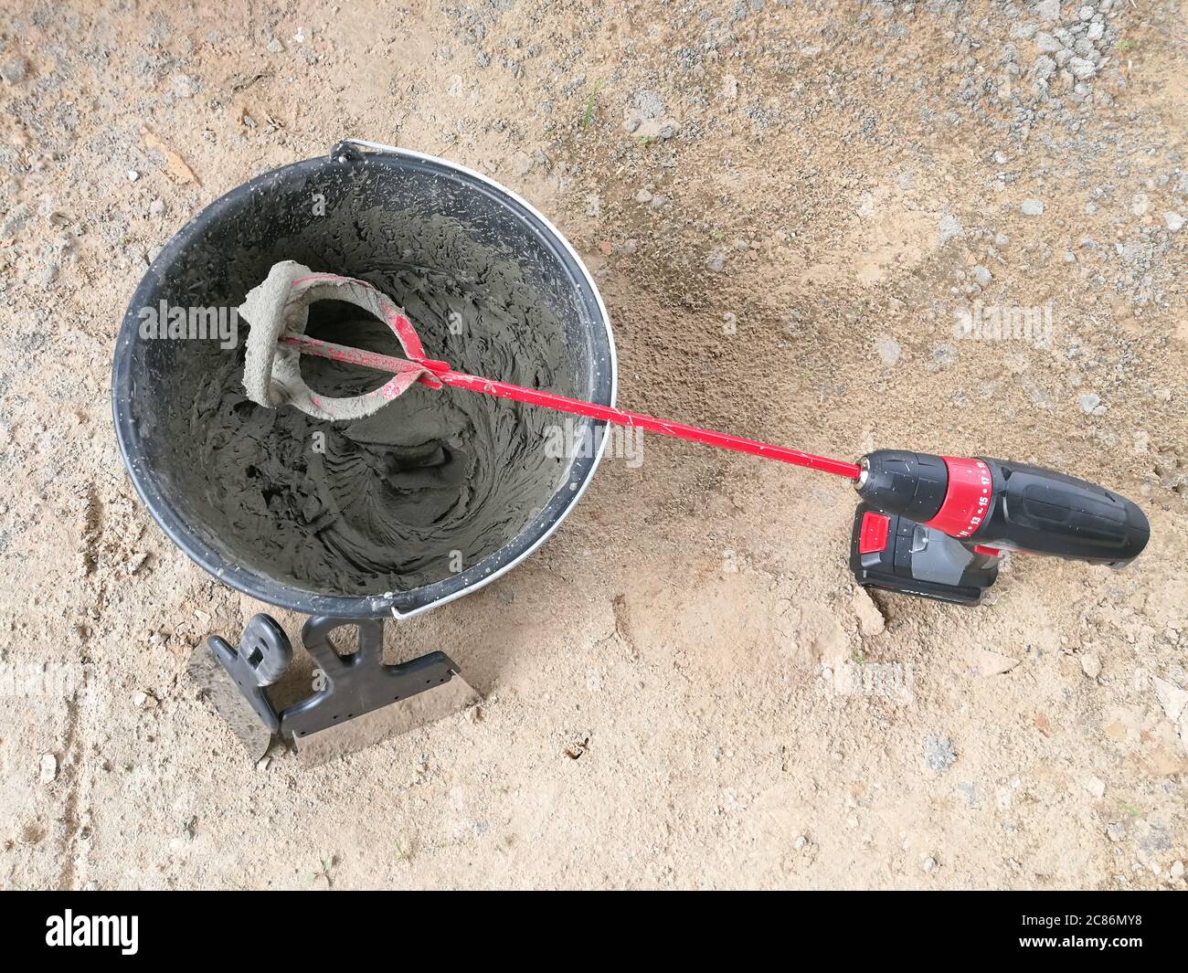 Drill glue mixer mixing construction glues in construction site Stock