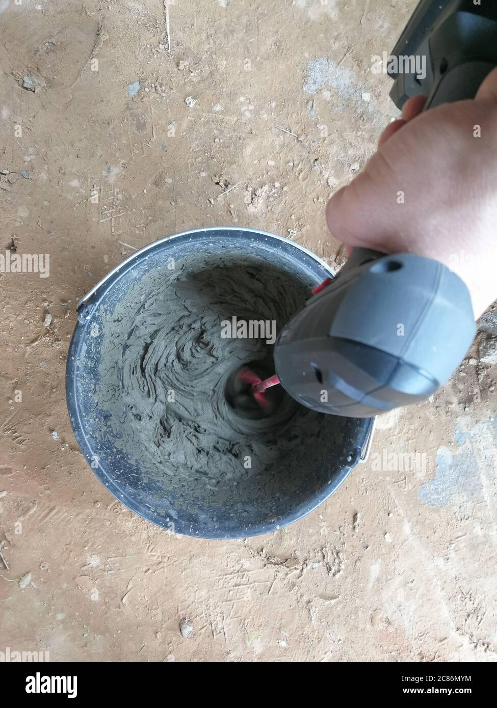 Drill glue mixer mixing construction glues in construction site Stock