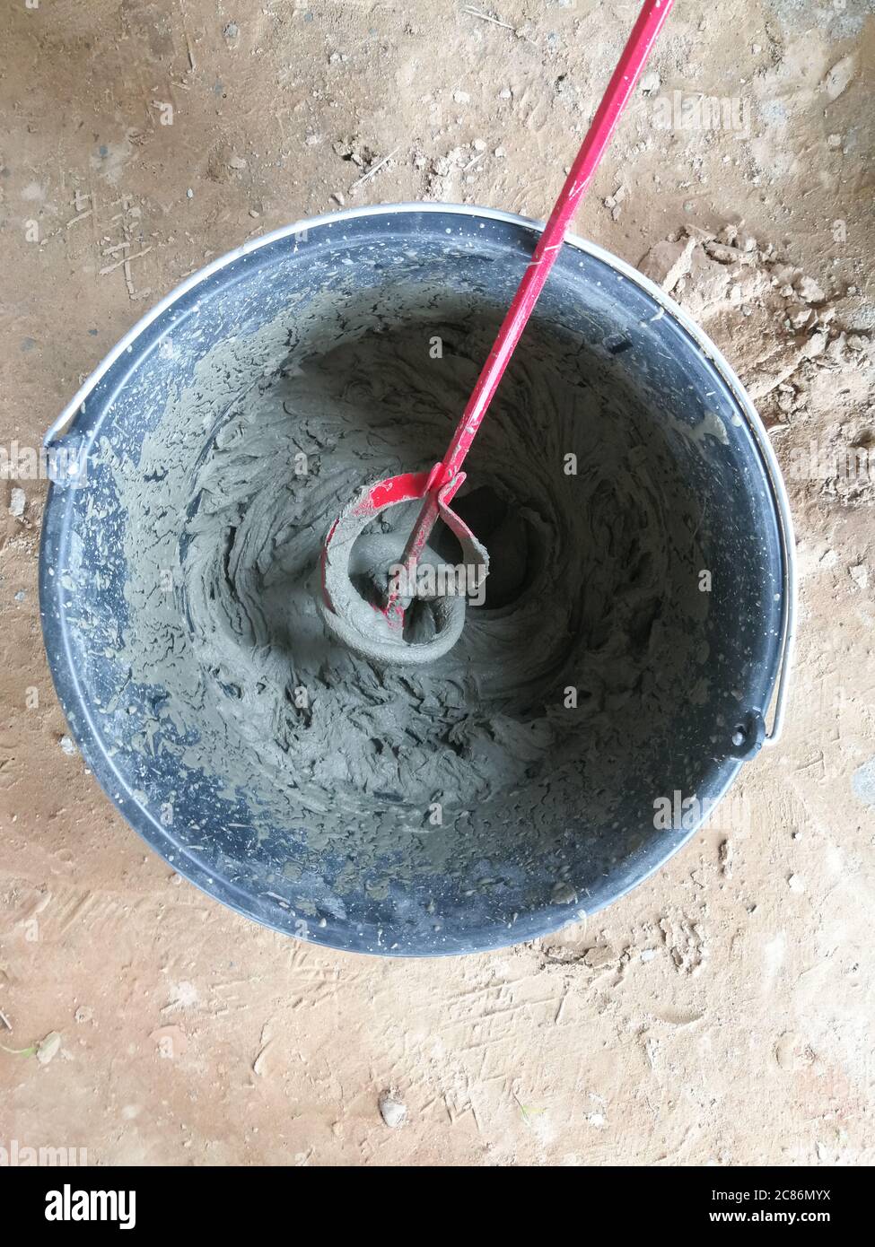 Drill glue mixer mixing construction glues in construction site Stock