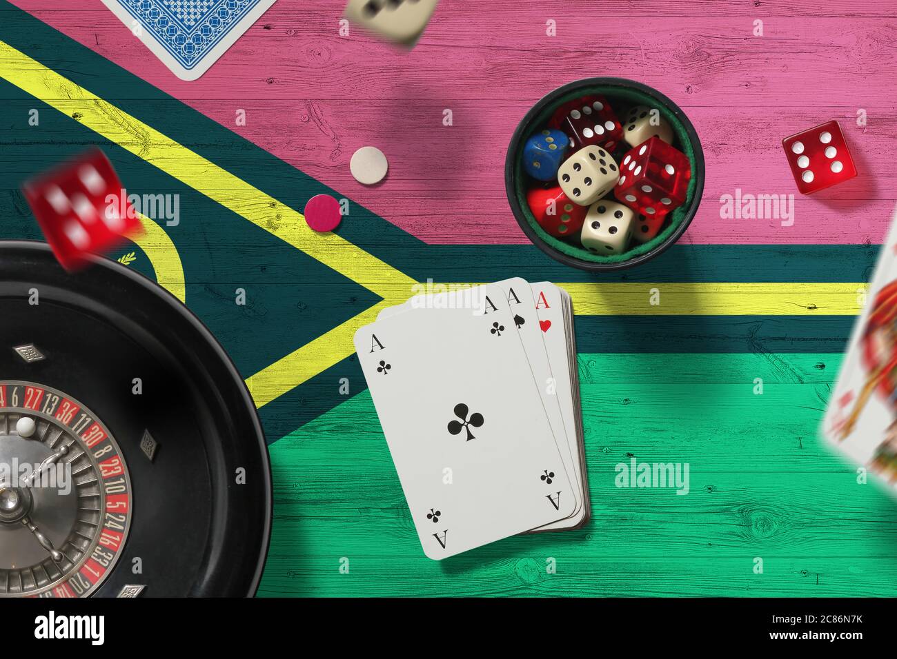 Vanuatu casino theme. Aces in poker game, cards and chips on red table
