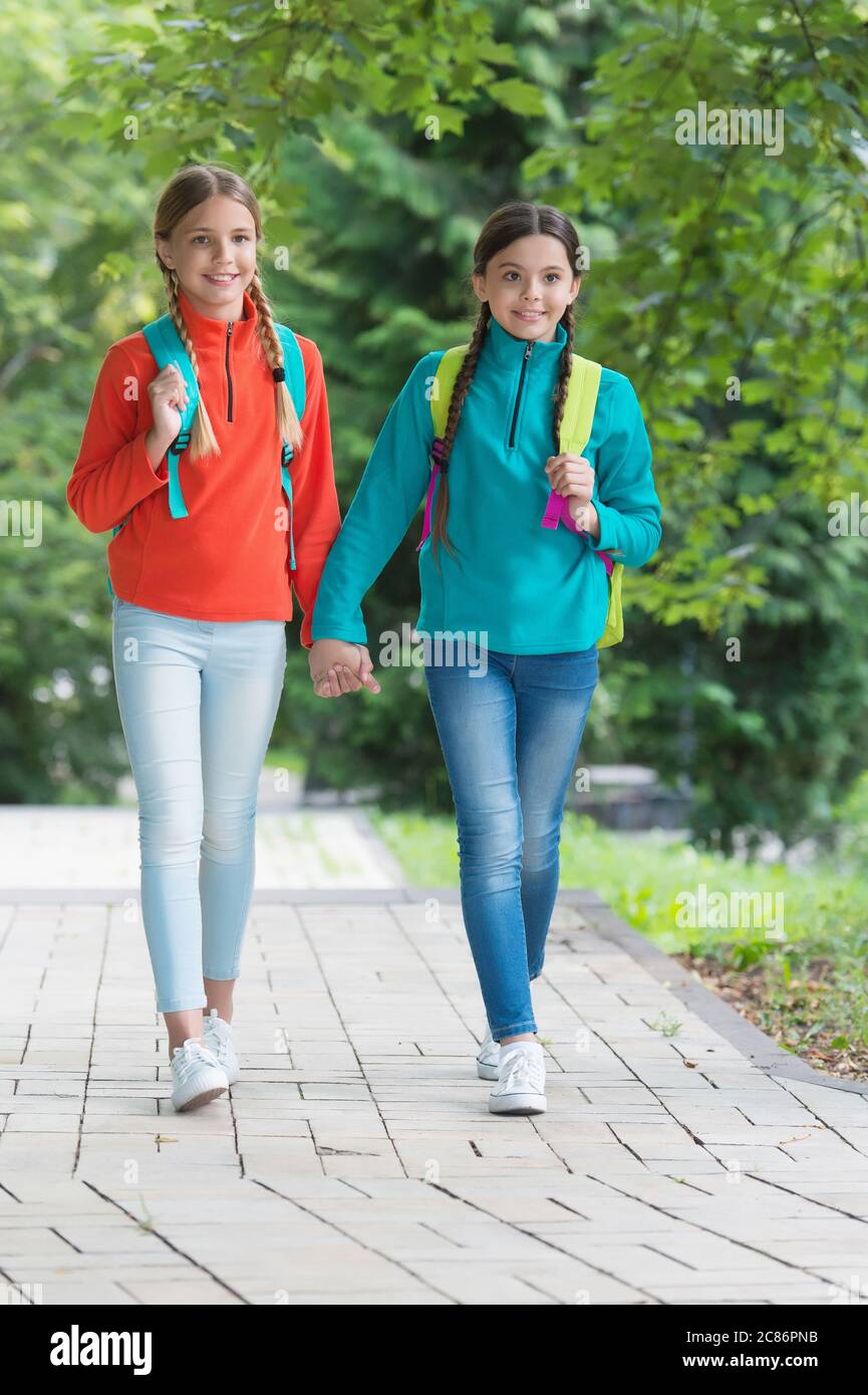 Family Values Small School Girls Walking In Spring Happy Childrens Day Childhood Hapiness Two Sisters In School Uniform Outdoor Ready For Holidays Happy Teen Kids Carry Backpack Back To School Stock Photo Family Values Small School Girls Walking In Spring Happy Childrens Day Childhood Hapiness Two Sisters In School Uniform Outdoor Ready For Holidays Happy Teen Kids Carry Backpack Back To School Stock Photo