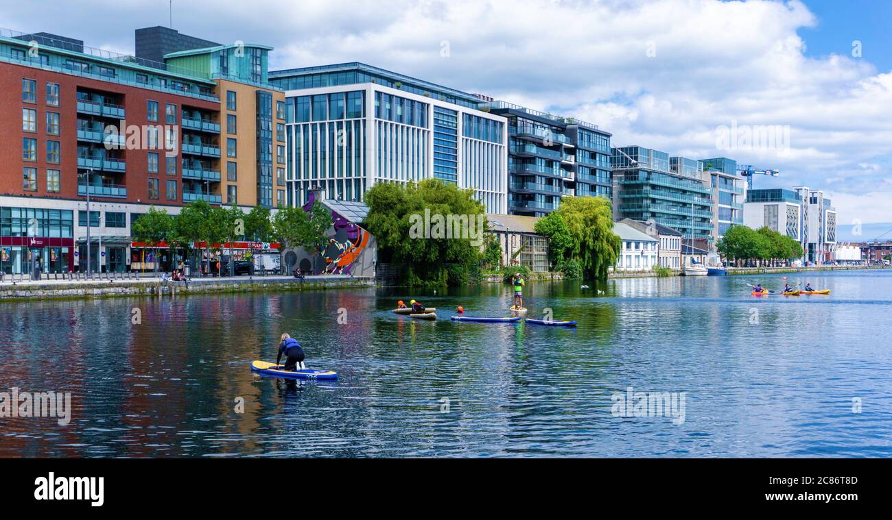 Grand Canal Dock. Recreation activities in Grand Canal Docks in Dublin,  ireland, with kayaking and paddle boarding in this city centre location  Stock Photo - Alamy