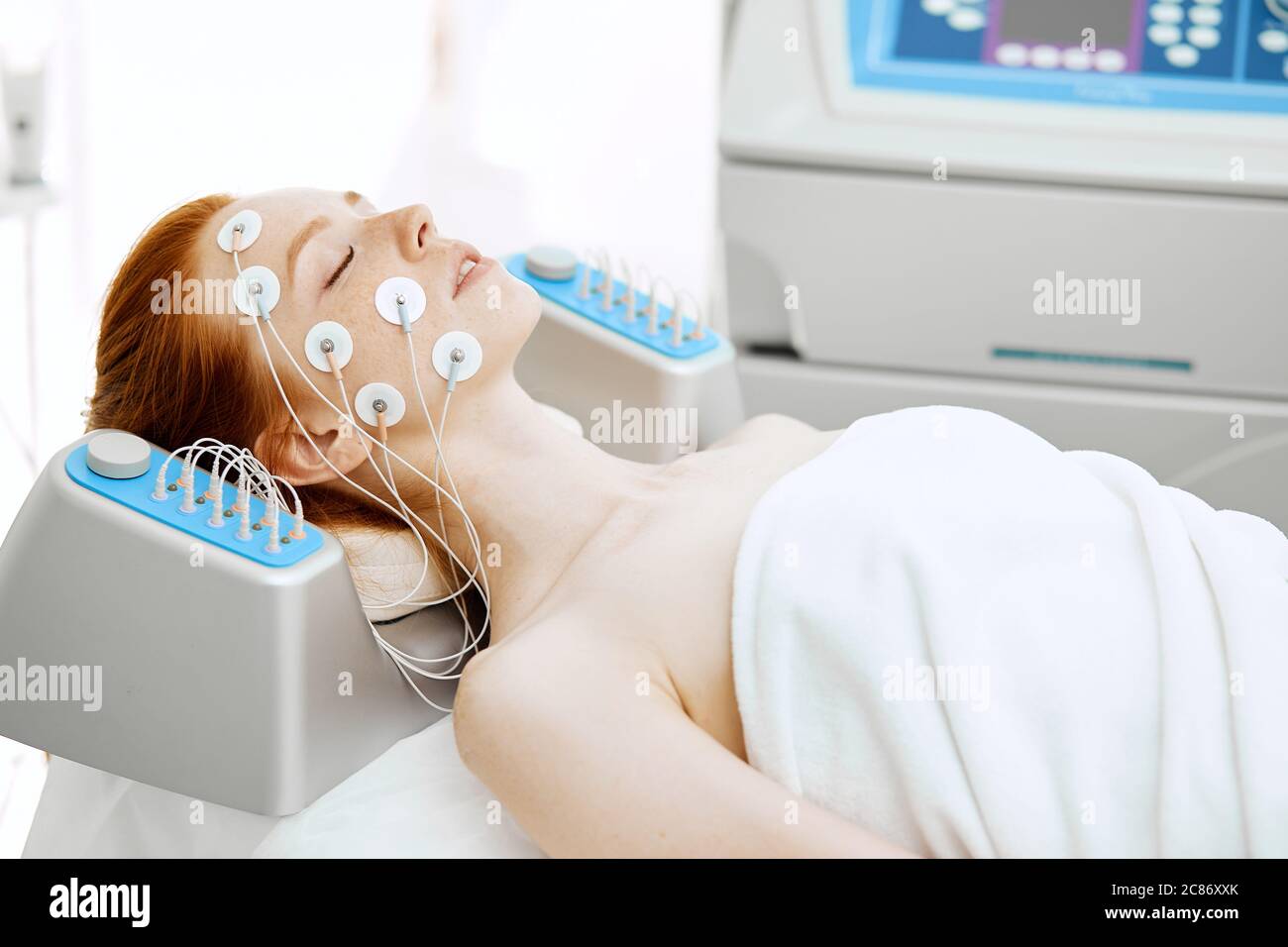 https://c8.alamy.com/comp/2C86XXK/hardware-cosmetology-face-and-body-care-spa-treatment-woman-getting-electrical-musculs-stimulation-lying-with-electrodes-on-face-in-beauty-salon-2C86XXK.jpg