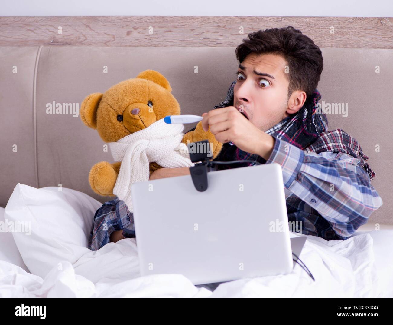 The sick man suffering from flu in the bed Stock Photo