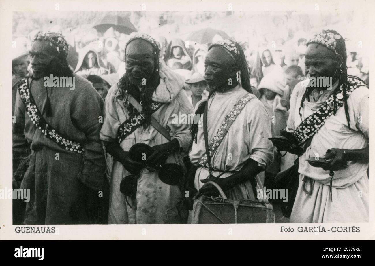 Gnawa musicians - ethnic group inhabiting Morocco and Algeria in the Maghreb. Gnawa music is characterized by instrumentation. Large, heavy iron castanets known as qraqab or krakebs as shown in this photo feature heavily. Gnawas perform a complex liturgy, called lila or derdeba. Stock Photo