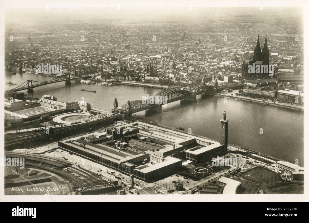 Aerial View of Cologne, Germany, featuring the Hohenzollern Bridge over the River Rhine and the spectacular medieval Dom (Cathedral). Stock Photo