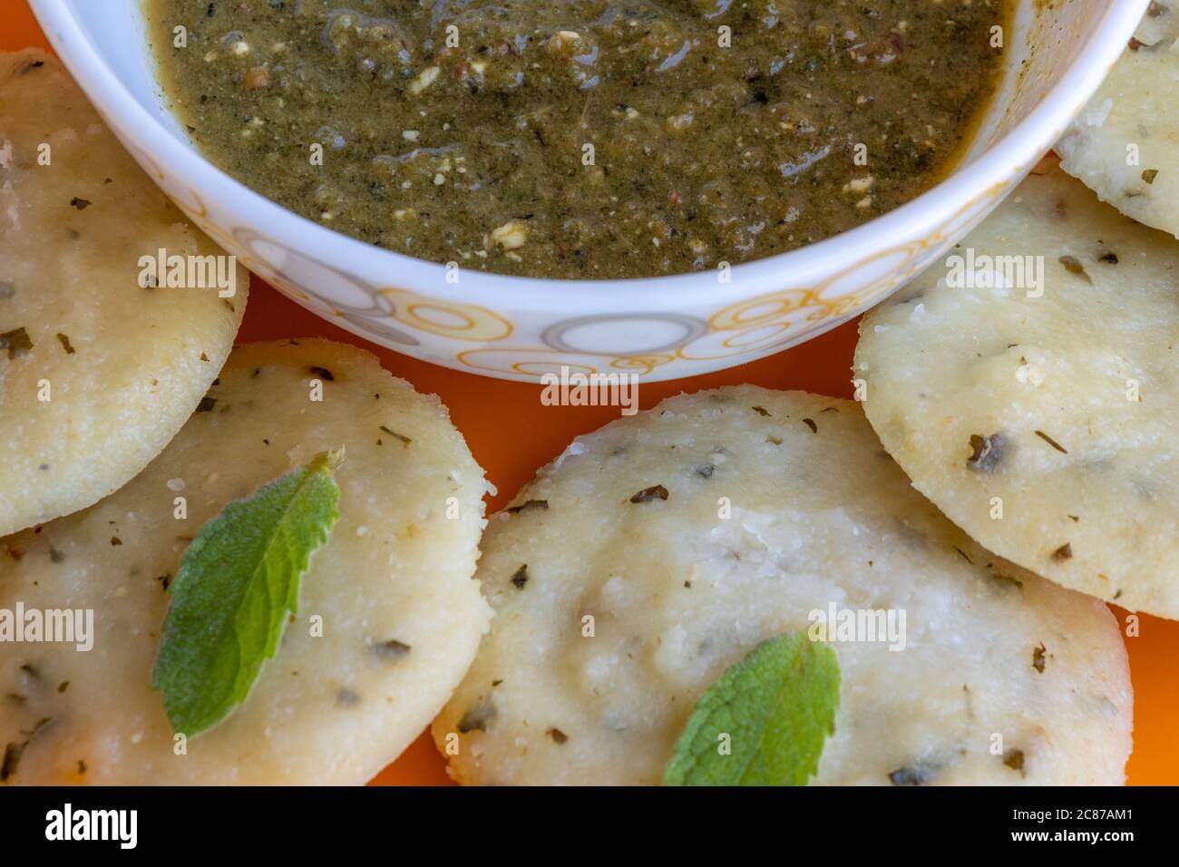Idli with green chutney, close up view, a famous south indian recipe Stock Photo