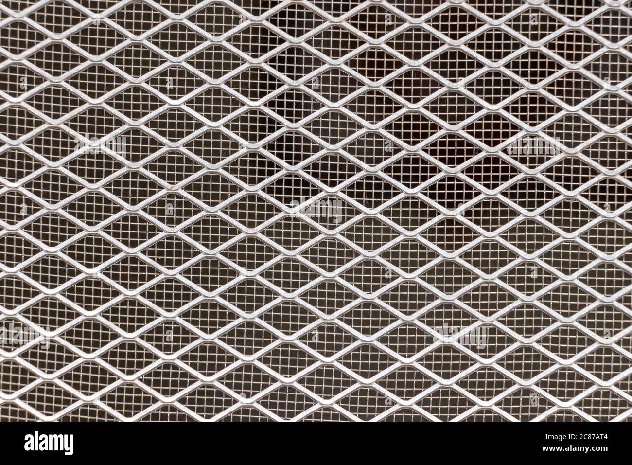 Net, steel and aluminum grid fence texture background and backdrop Stock Photo