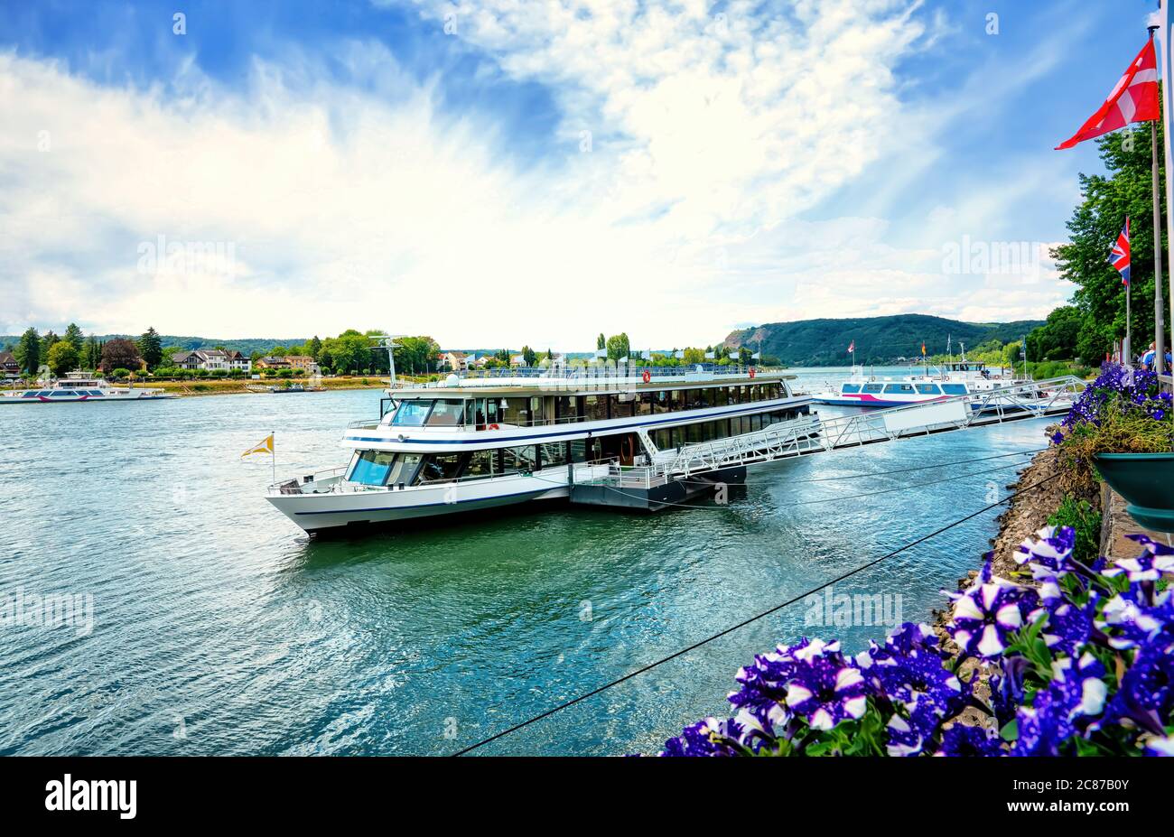 Rhine bank with ferry and sightseeing boat in Linz am Rhein (Linz on the rhine), Germany Stock Photo