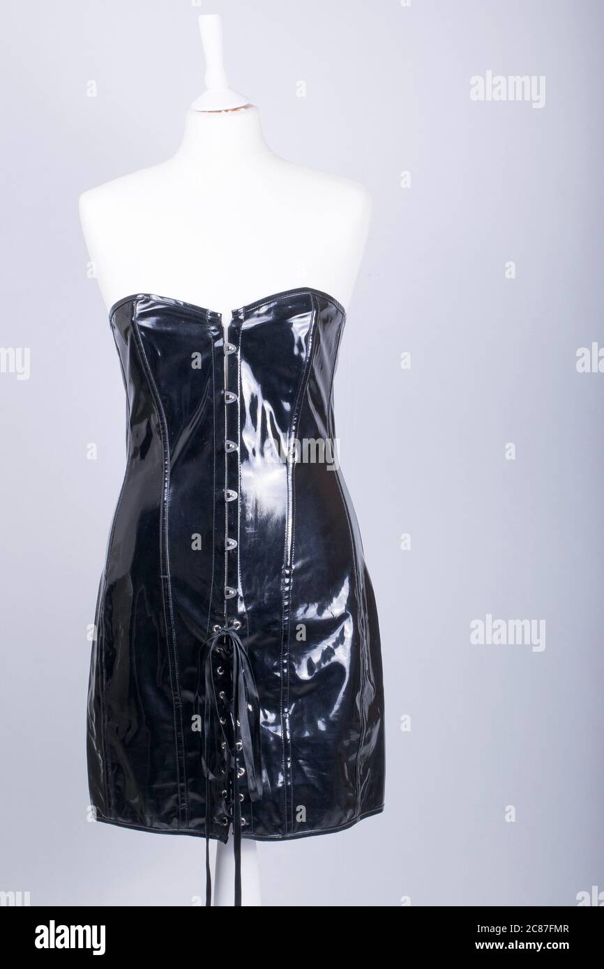 Tailors Mannequin dressed in a Black PVC Corset Dress Stock Photo