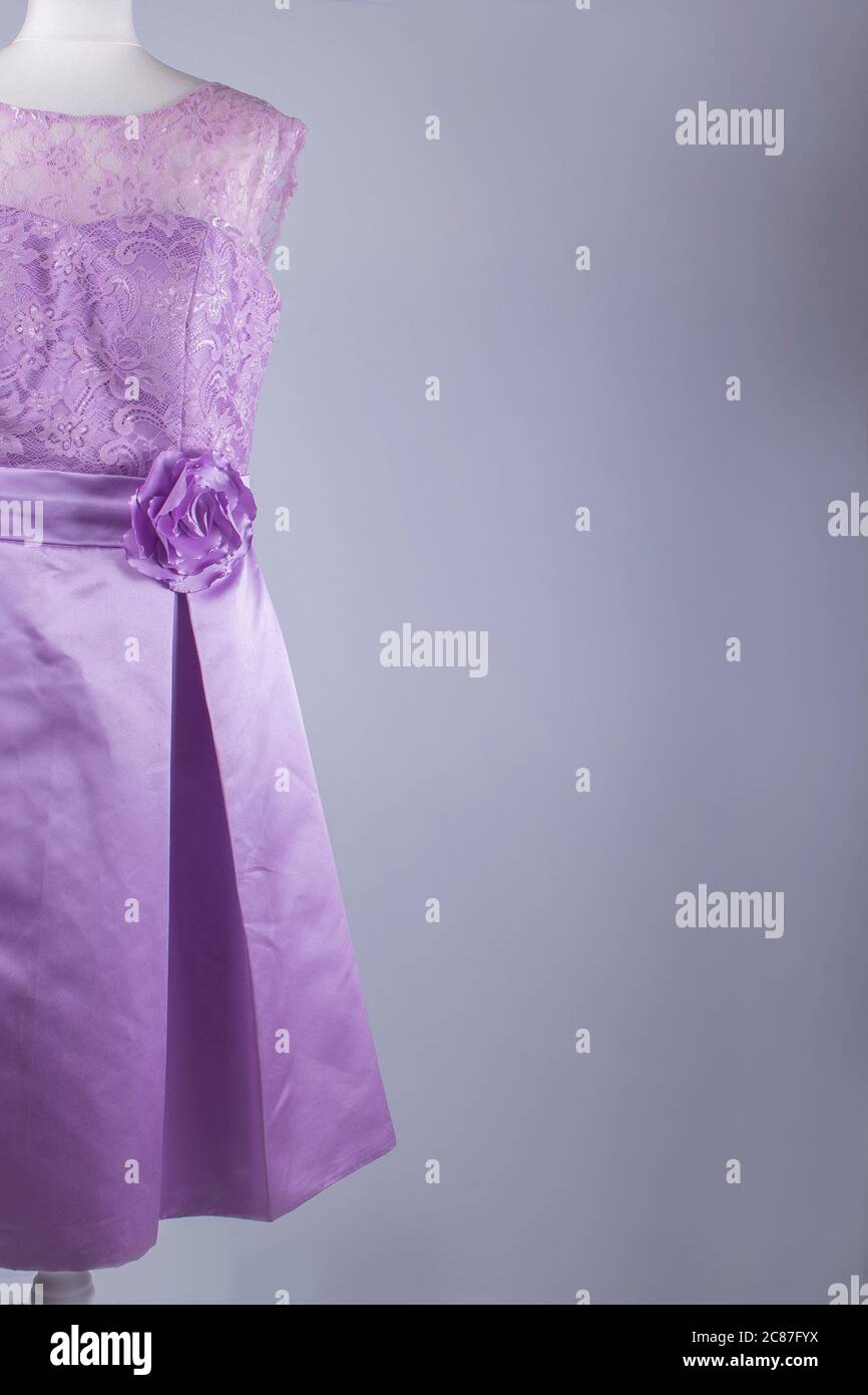 A Tailors Mannequin dressed in a Purple Dress Stock Photo - Alamy