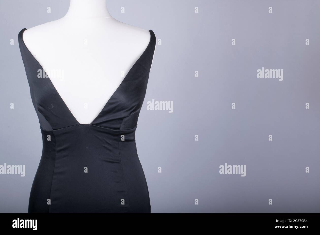 A Tailors Mannequin dressed in a Black Satin Dress Stock Photo - Alamy