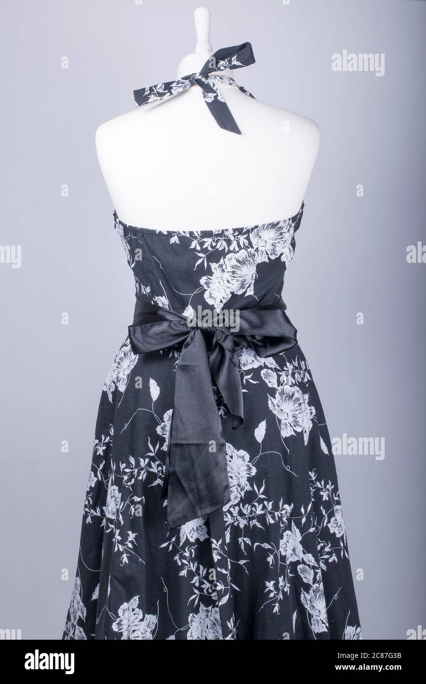 A Tailors Mannequin dressed in a Black and White Floral Dress with ...