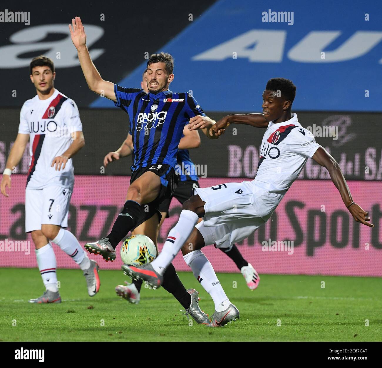 Bergamo. 22nd July, 2020. Atalanta's Remo Freuler (C) vies with Bologna's Ibrahima Mbaye (R) during a Serie A football match in Bergamo, Italy, July 21, 2020. Credit: Xinhua/Alamy Live News Stock Photo