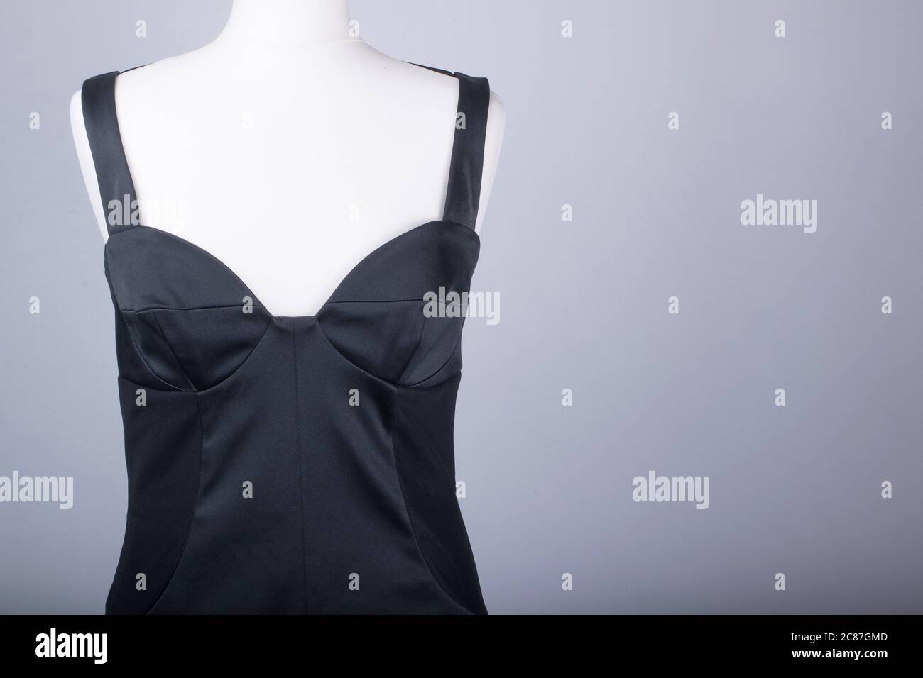 A Tailors Mannequin dressed in a Black Satin Dress Stock Photo