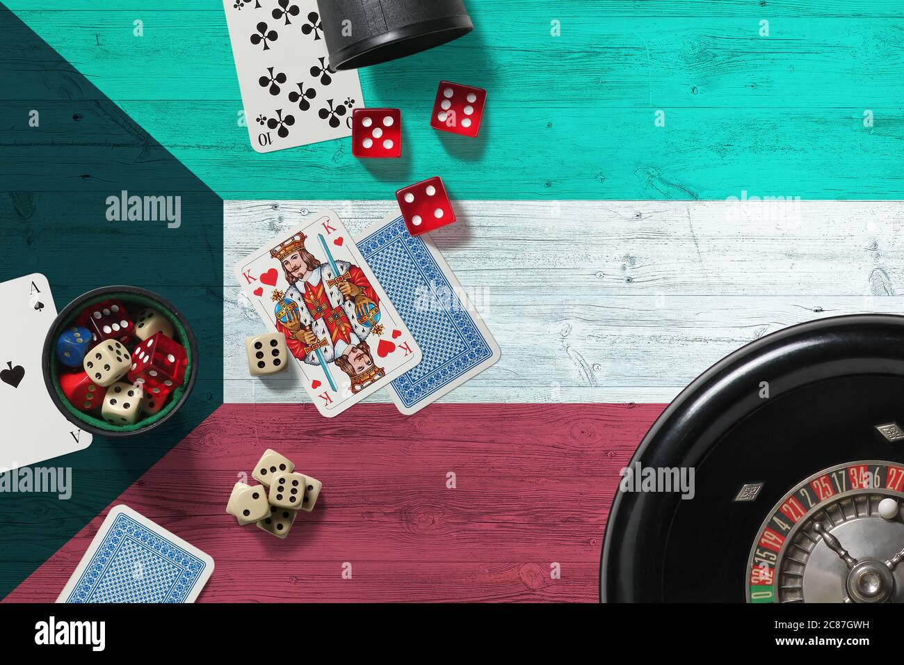 Kuwait casino theme. Aces in poker game, cards and chips on red table