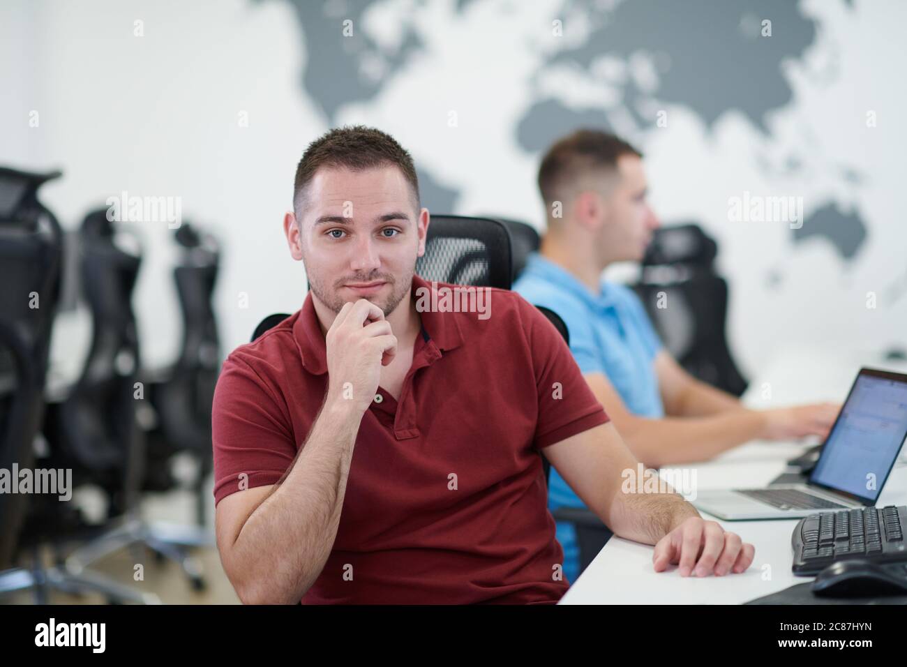 startup business, two male software developers working on computer at new modern open plan office Stock Photo