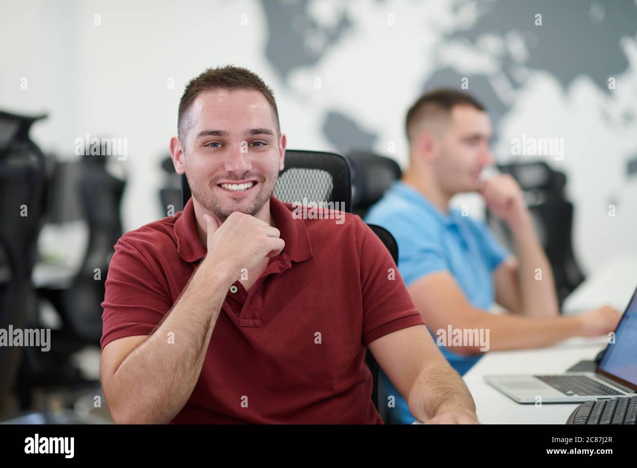 startup business, two male software developers working on computer at new modern open plan office Stock Photo