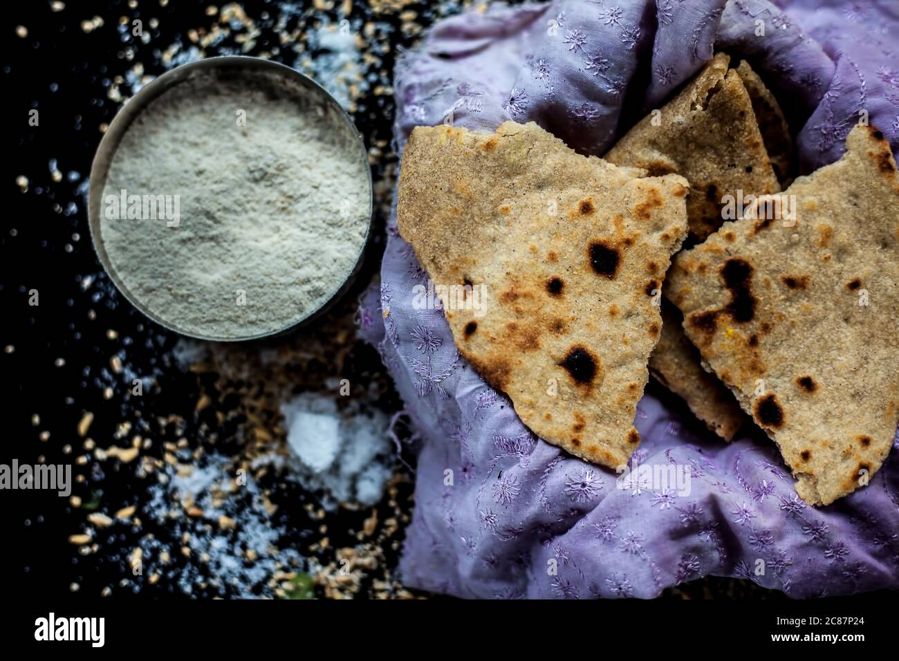 Shot of Gujarati breakfast consisting of round bread bhakri and lasun