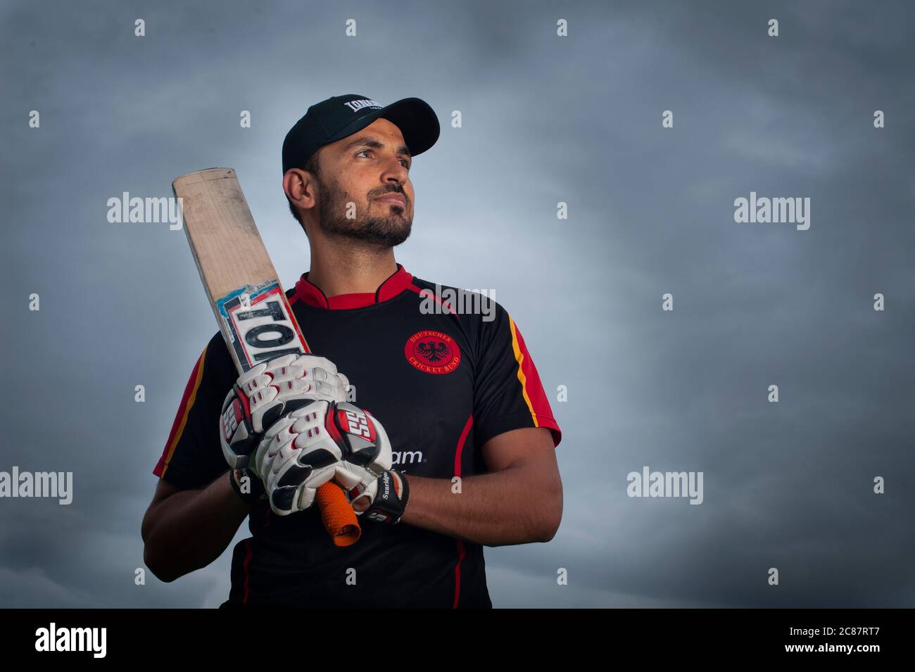 21 year old Muslim Yar Ashraf. Afghan refugee and now German National Cricket team player, In training with his local team of MSC Frankfurt, Germany. Stock Photo