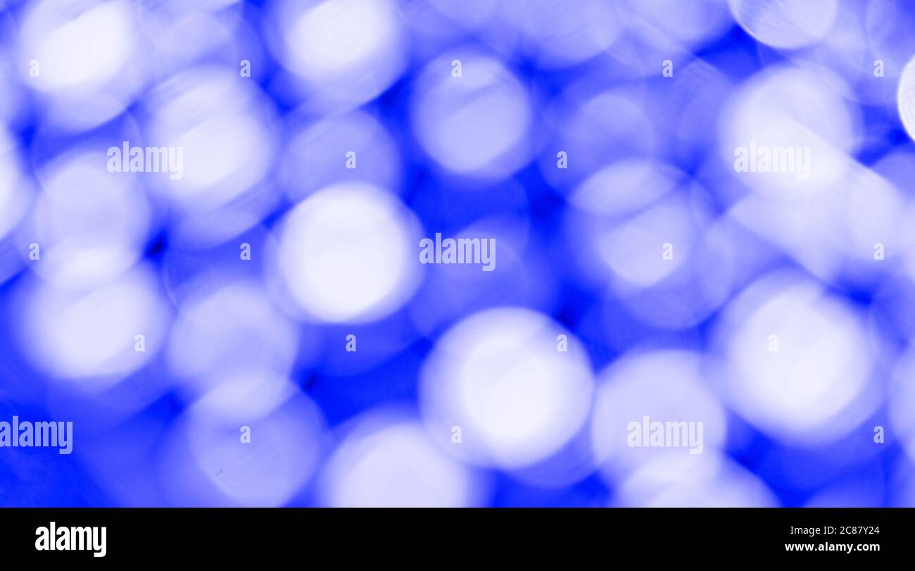 Blue bokeh light backgrounds. Blurred defocused dots. Abstract blurred reflection lighting. Bokeh with festive light background. Stock Photo