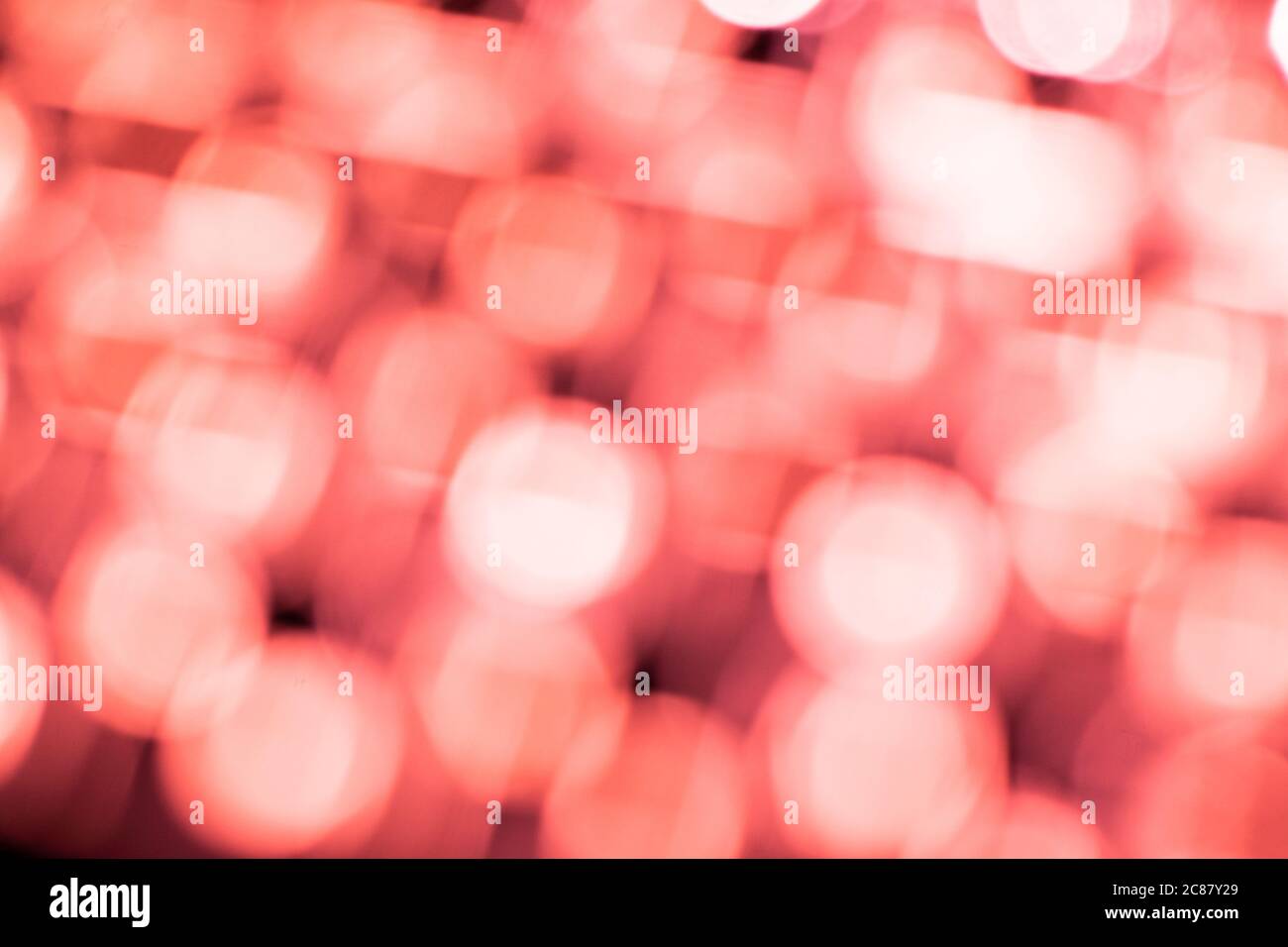 Red bokeh light backgrounds. Blurred defocused dots. Abstract blurred reflection lighting. Bokeh with festive light background. Stock Photo