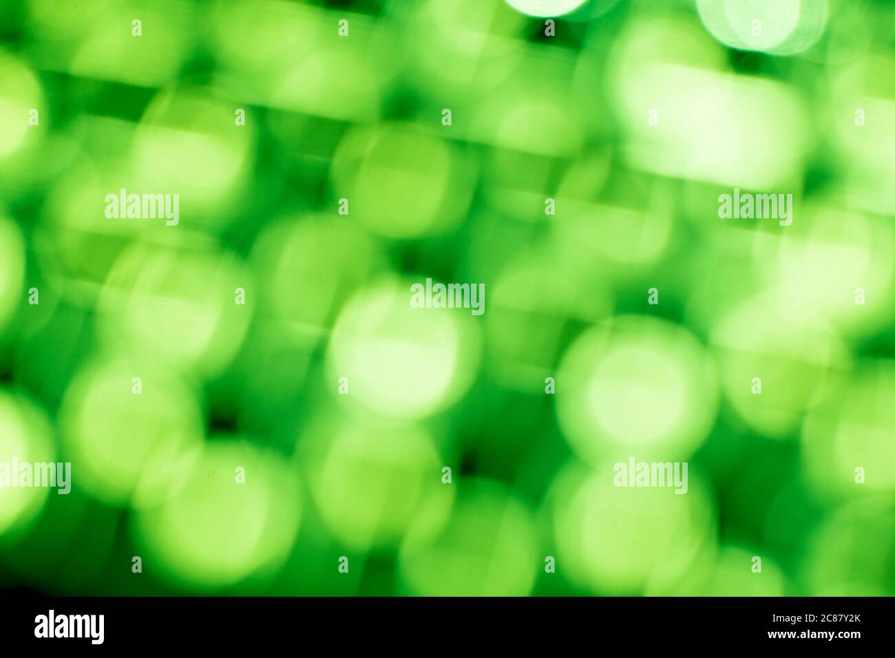 Green bokeh light backgrounds. Blurred defocused dots. Abstract blurred reflection lighting. Bokeh with festive light background. Stock Photo