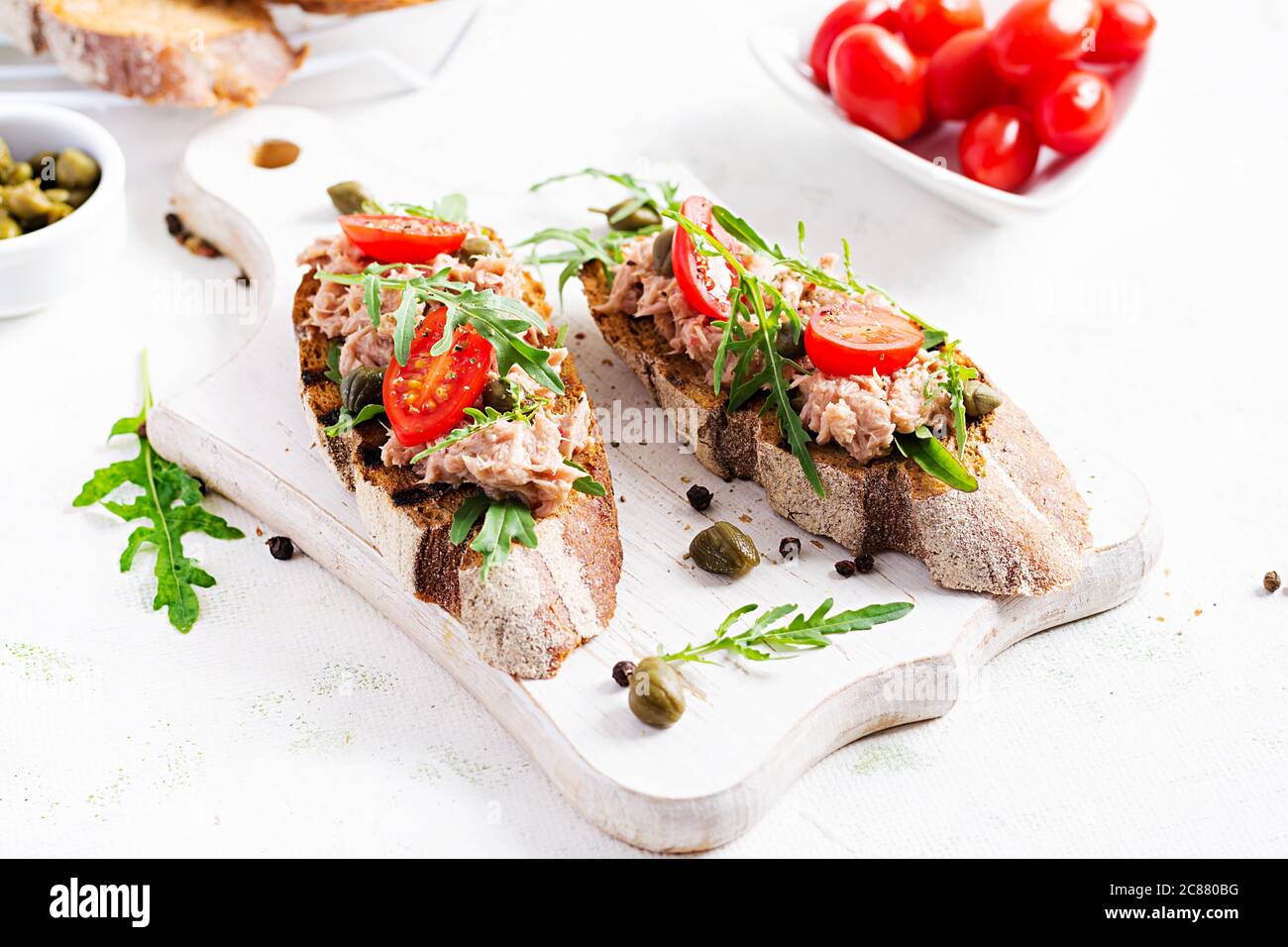 Toasts with tuna. Italian bruschetta sandwiches with canned tuna