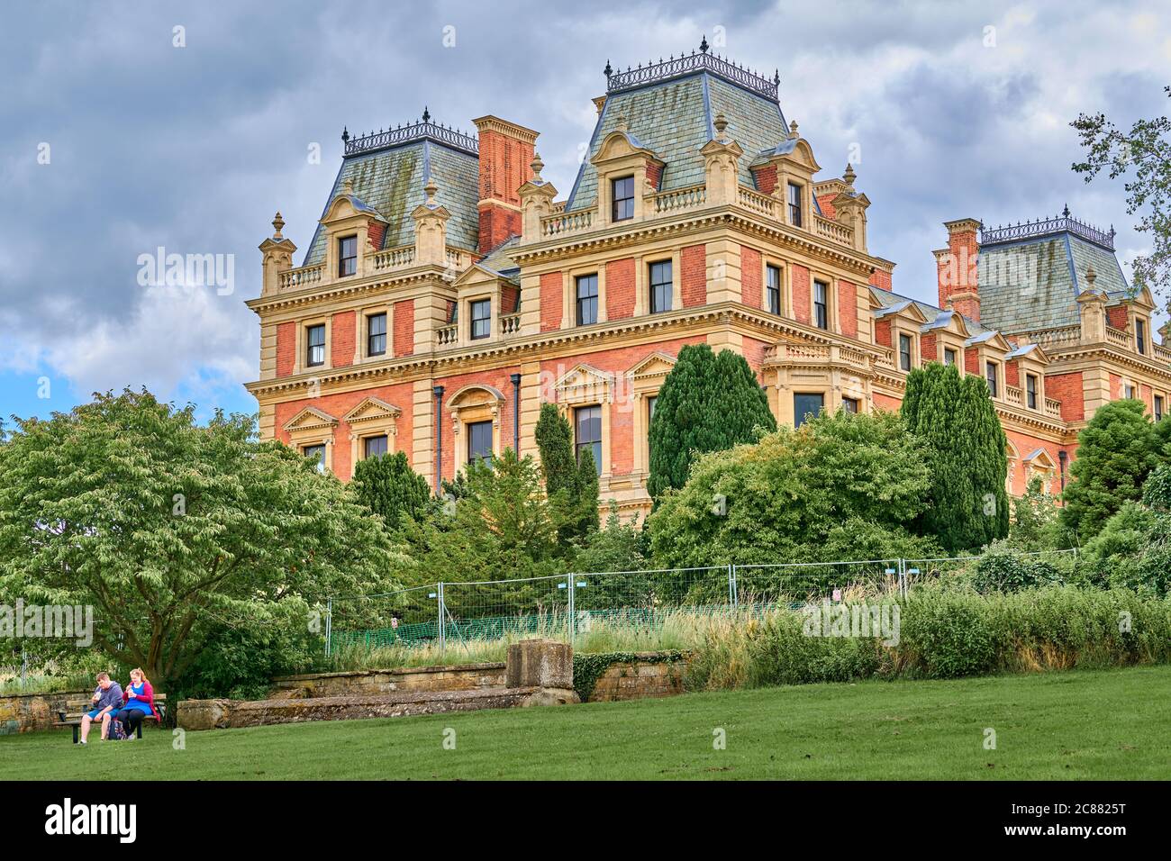 A couple sit outside East Carlton hall, originally built in the late 1700's, now a private