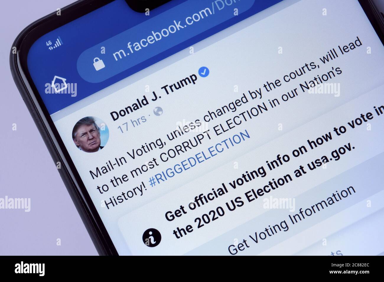 Stone / United Kingdom - July 22 2020: Facebook post of Donald Trump with a newly introduced Facebook post label. Labelling aimed to reduce misinformation Stock Photo