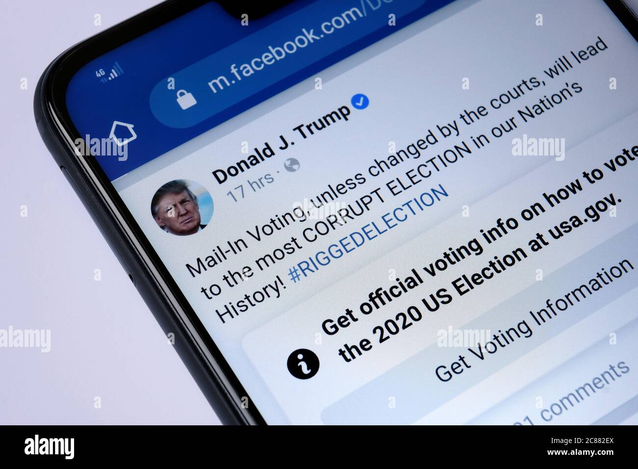 Stone / United Kingdom - July 22 2020: Facebook post of Donald Trump with a newly introduced Facebook post label. Labelling aimed to reduce misinformation Stock Photo