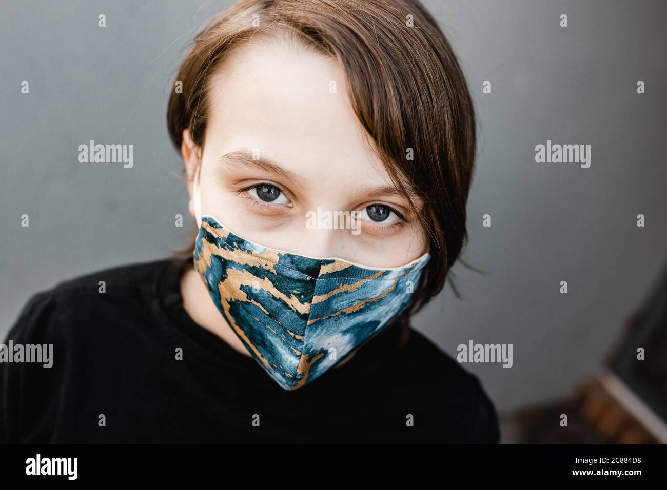 boy child wearing fabric masks during the corona COVID19 pandemic