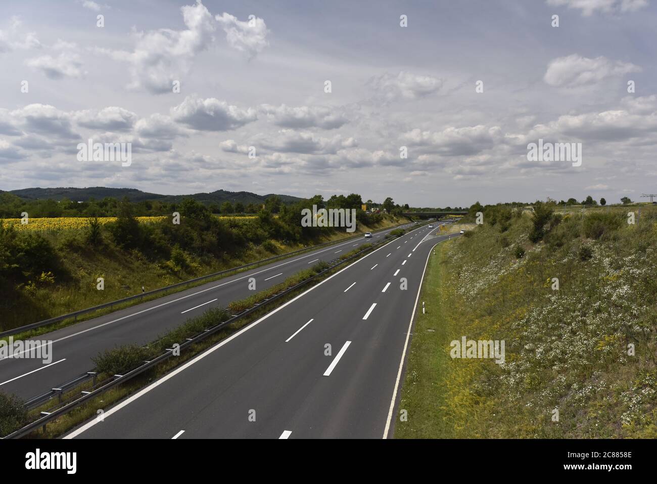 Highway through the field of sunflowers Stock Photo - Alamy