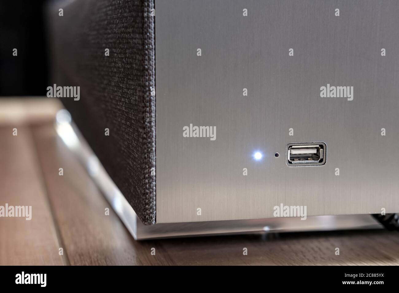Shallow focus of a USB port on the side panel of a luxury hires music