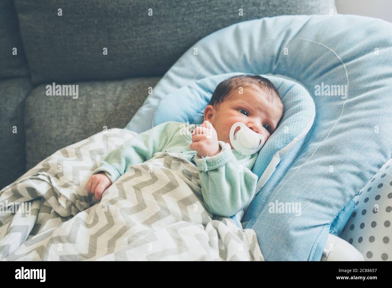 Newborn girl using a pacifier Stock Photo Alamy