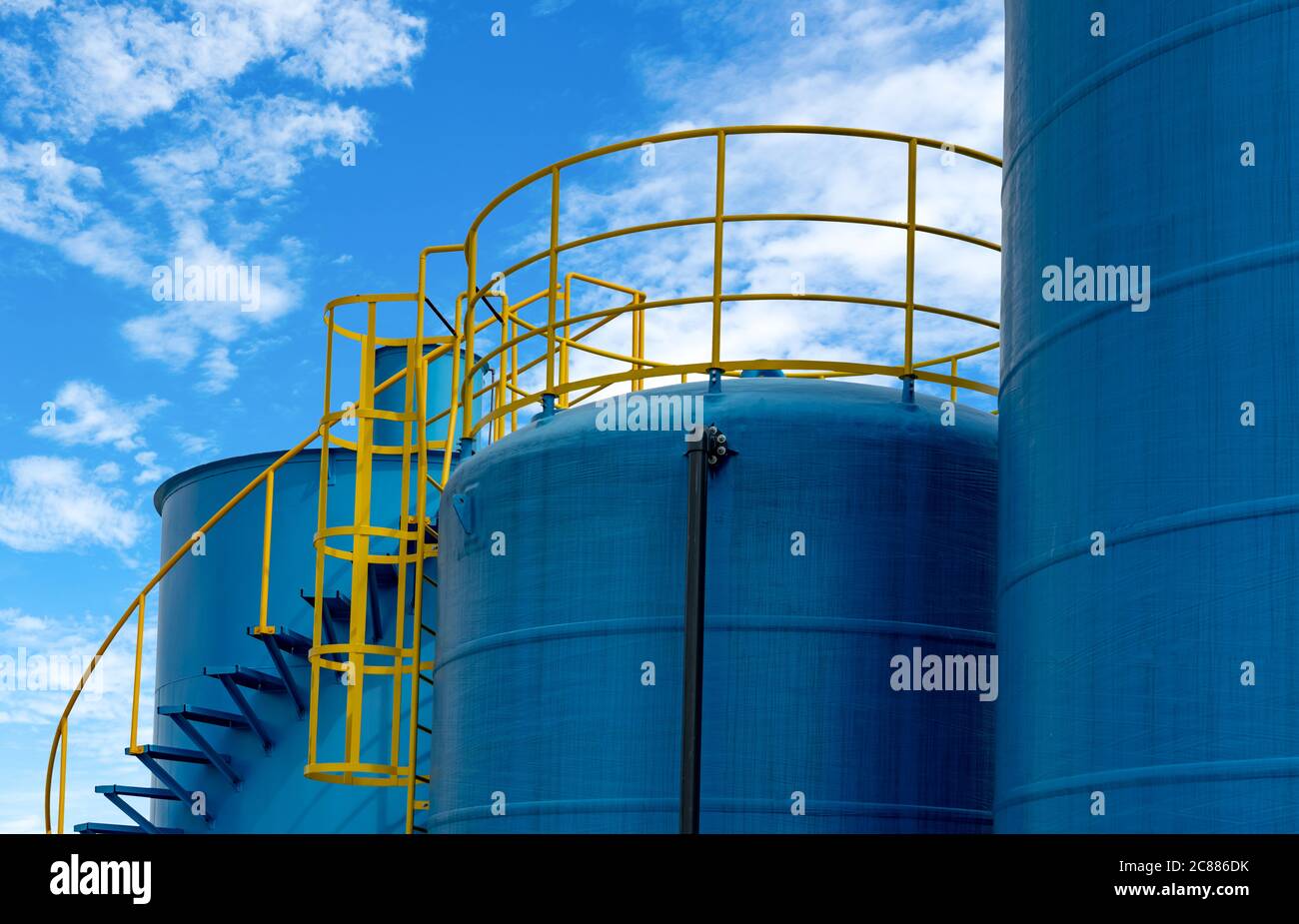 Closeup fuel storage tank in petroleum refinery. Blue big tank of oil