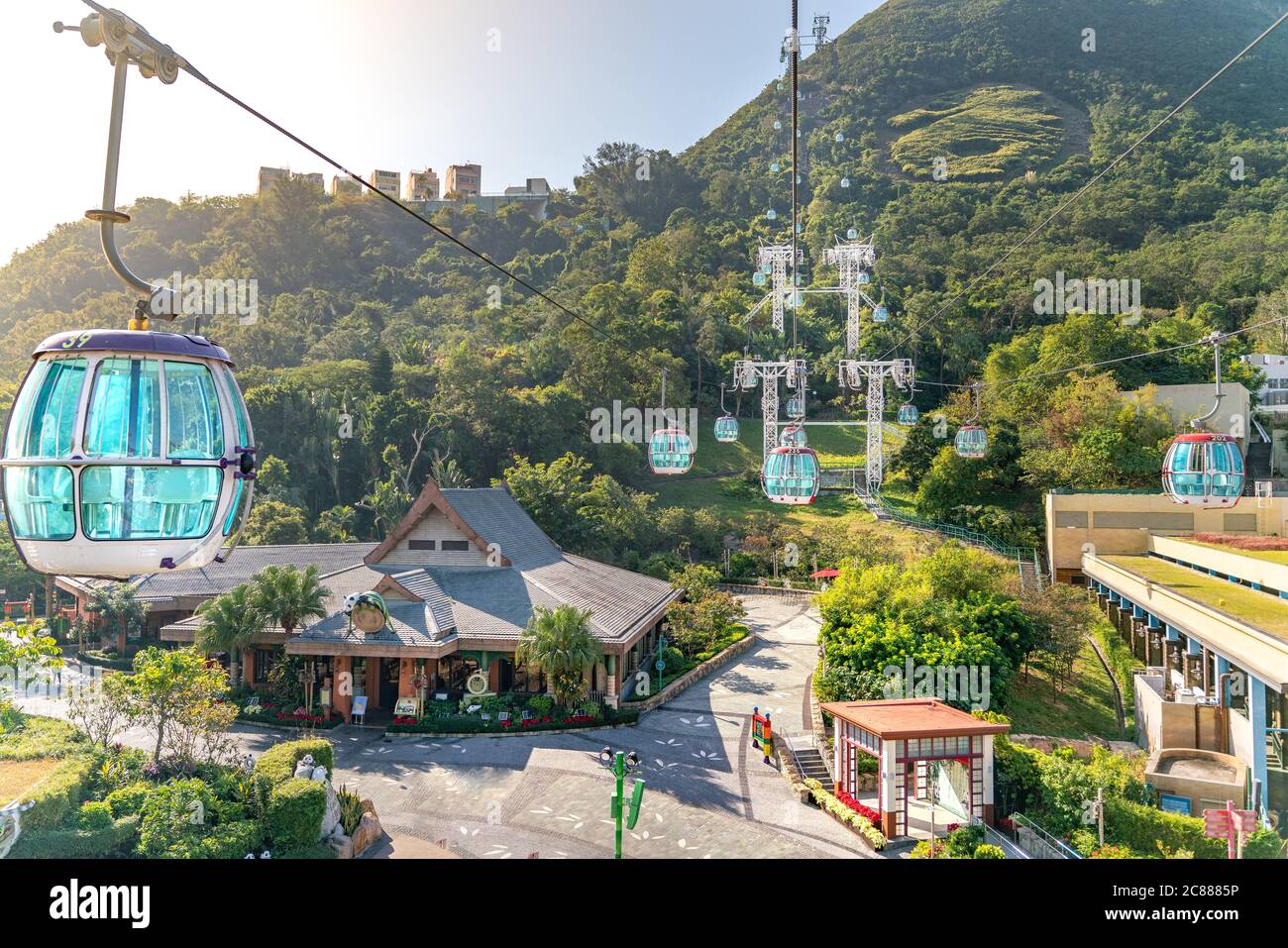 The sunny view of cable car and theme park near to ocean Stock Photo