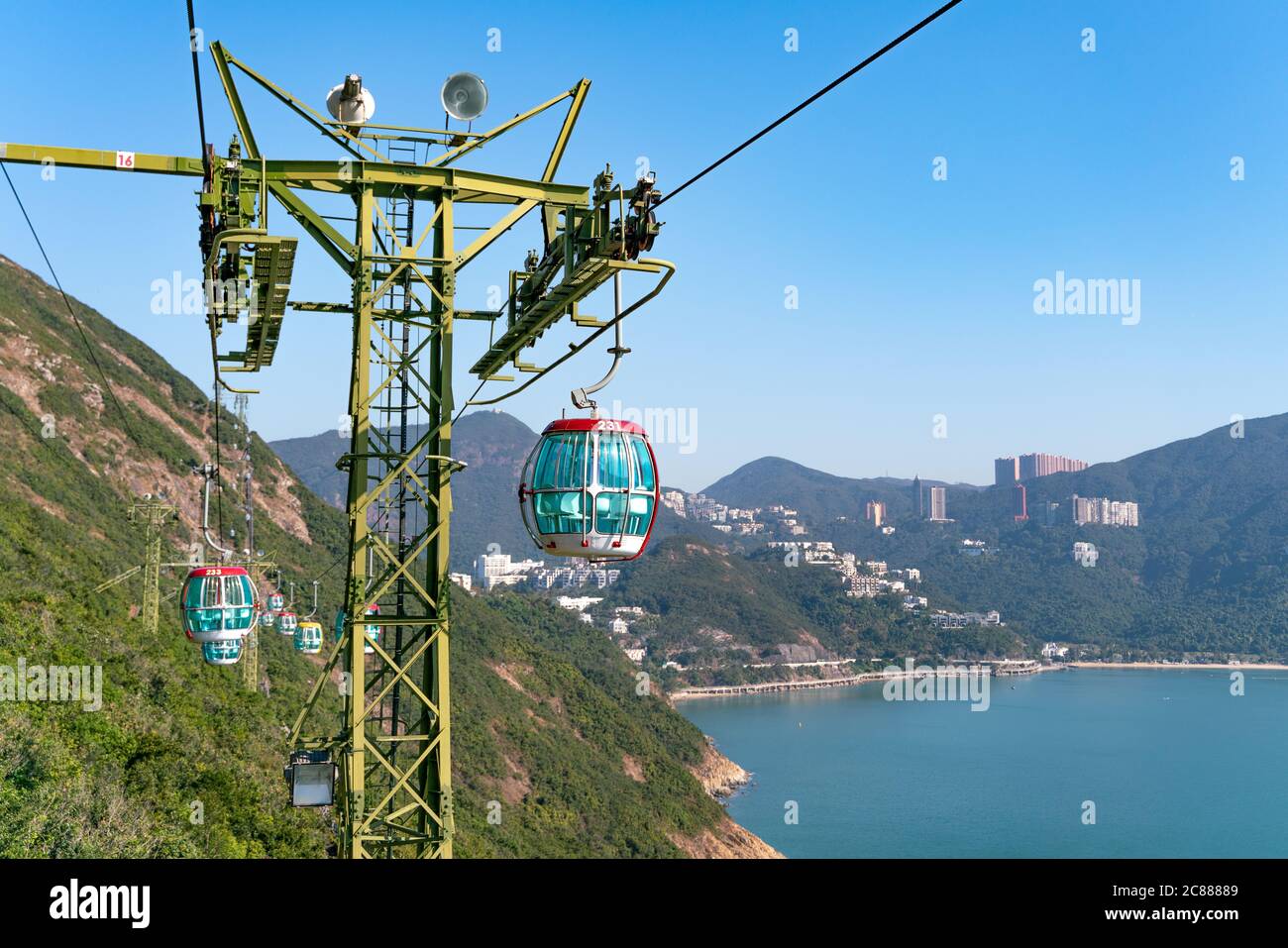 The sunny view of cable car and theme park near to ocean Stock Photo