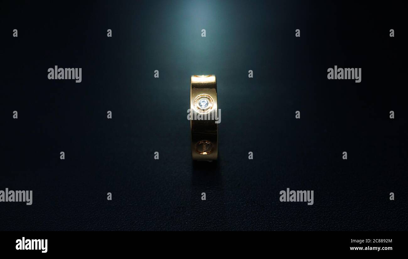 wedding rings on black background Stock Photo