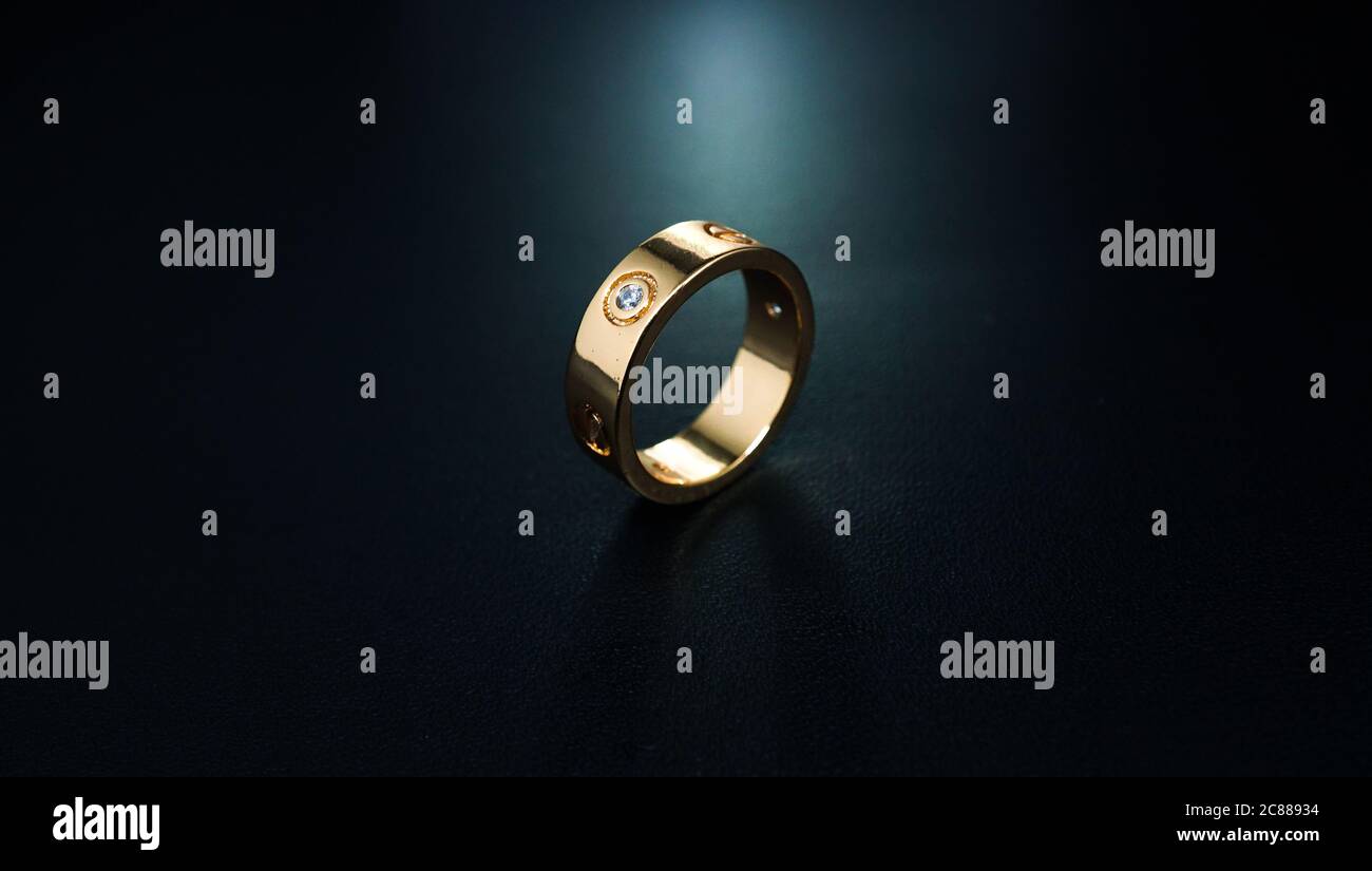 wedding rings on black background Stock Photo Alamy
