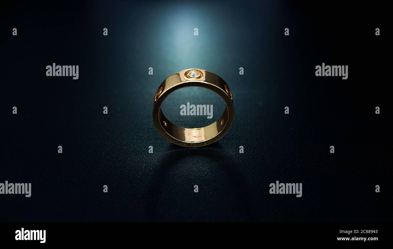 wedding rings on black background Stock Photo Alamy
