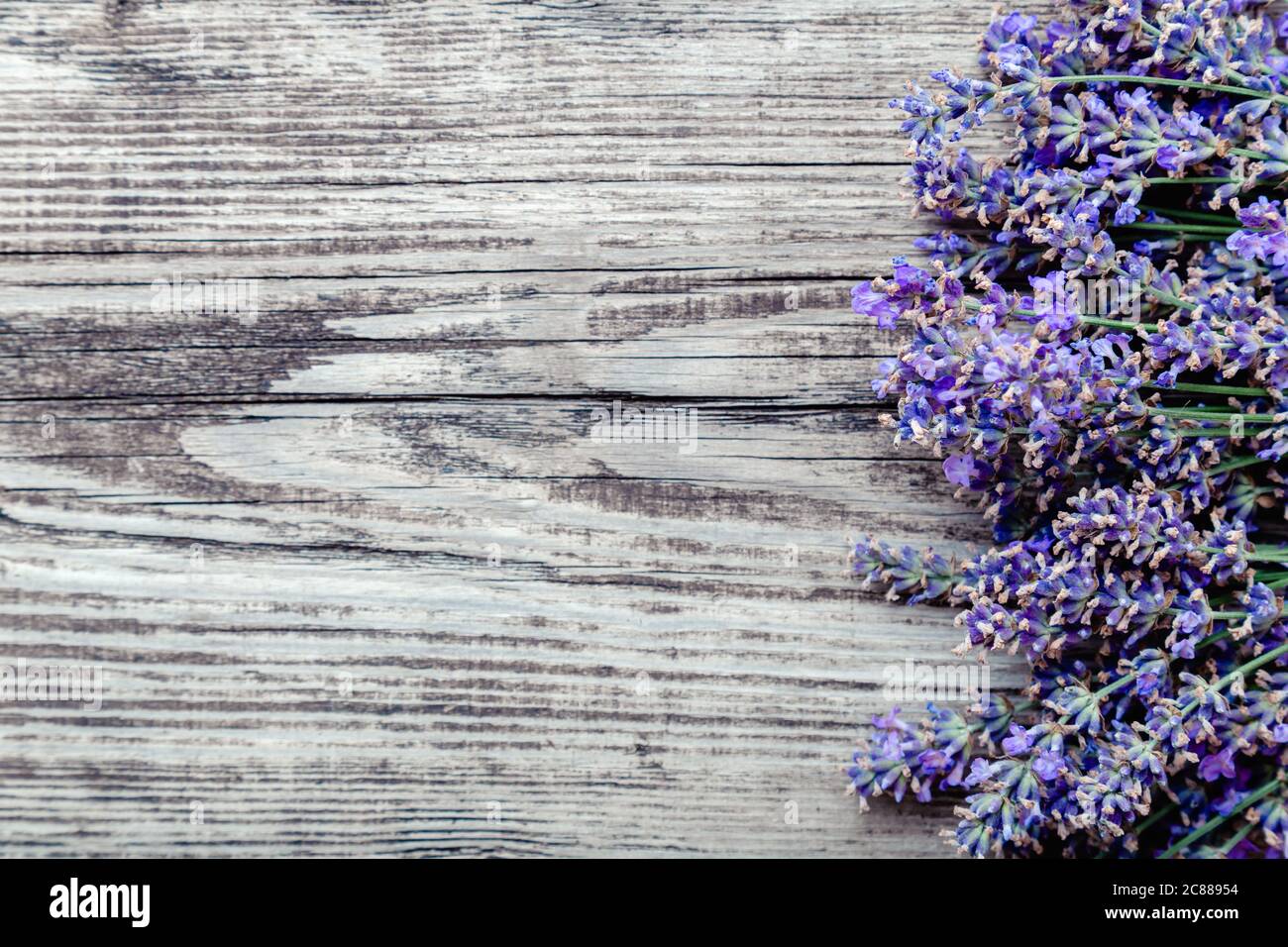 Fresh lavender flowers blossom on old rustic wooden board background with  copy space for text. Flatlay french provence style lavender flower blossom  Stock Photo - Alamy