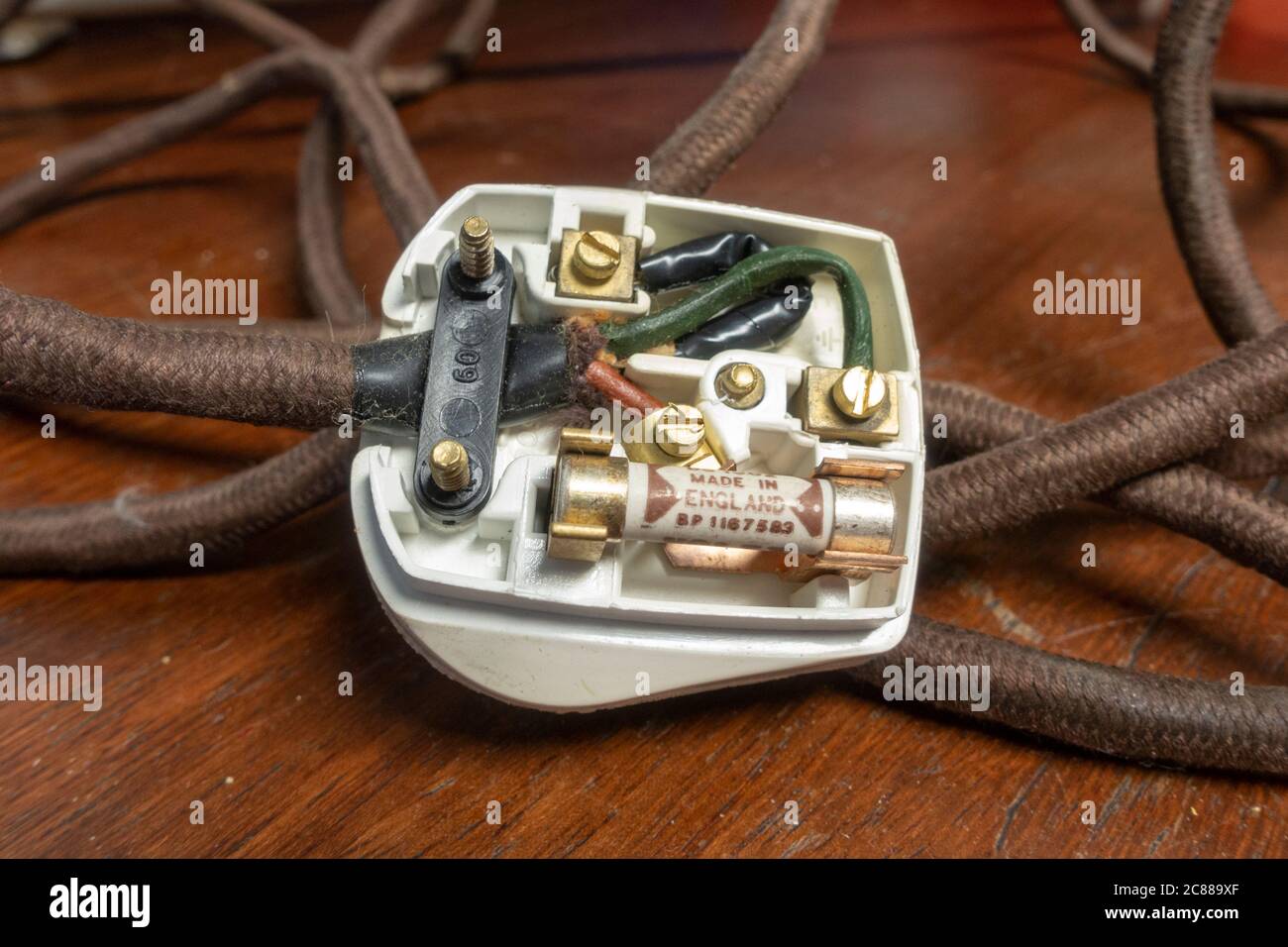 An old UK plug with black (neutral), green (earth) and brown (live) wires  Stock Photo - Alamy