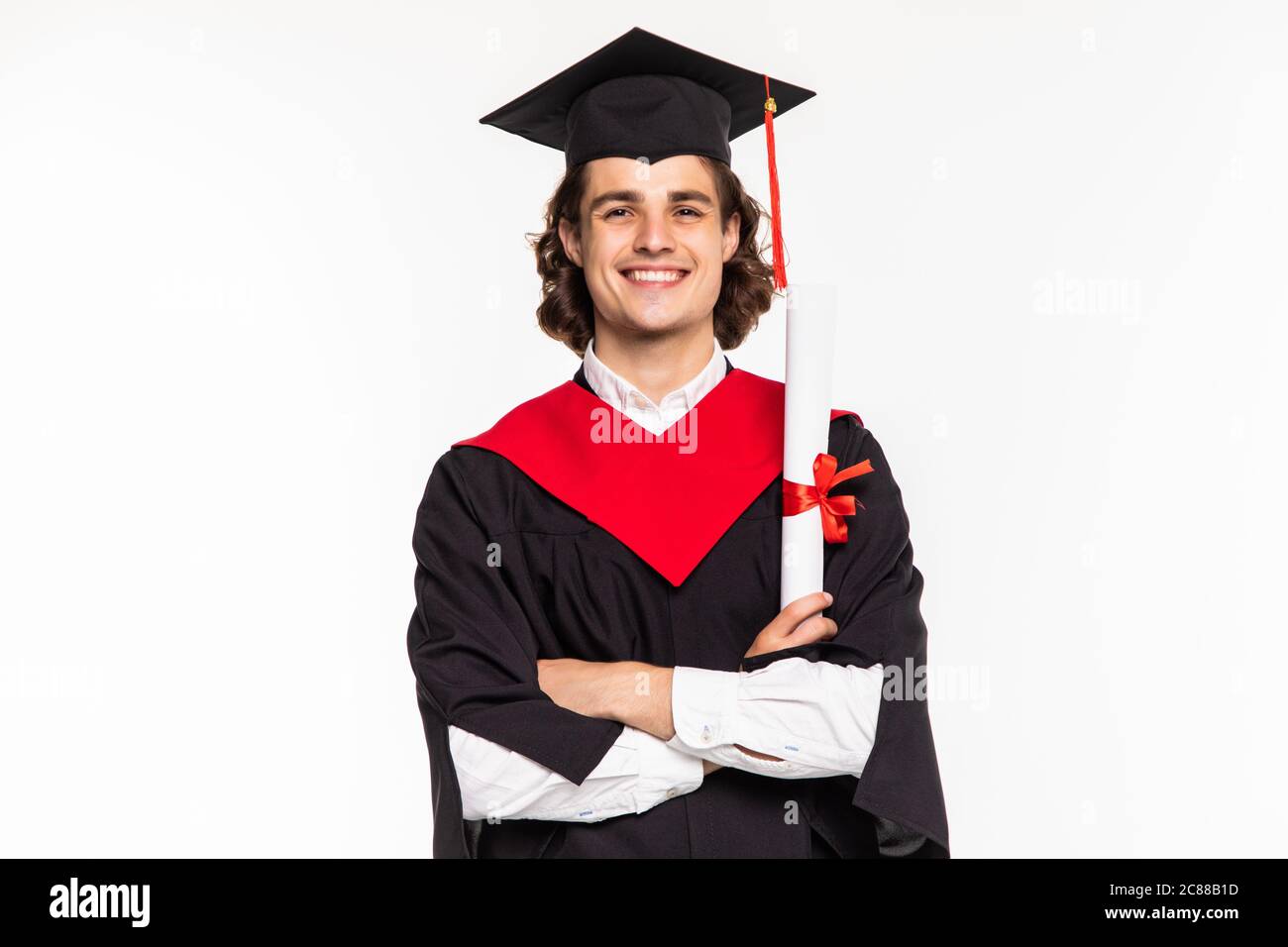 Portrait of a man in graduation robes holding a diploma Stock Photo - Alamy