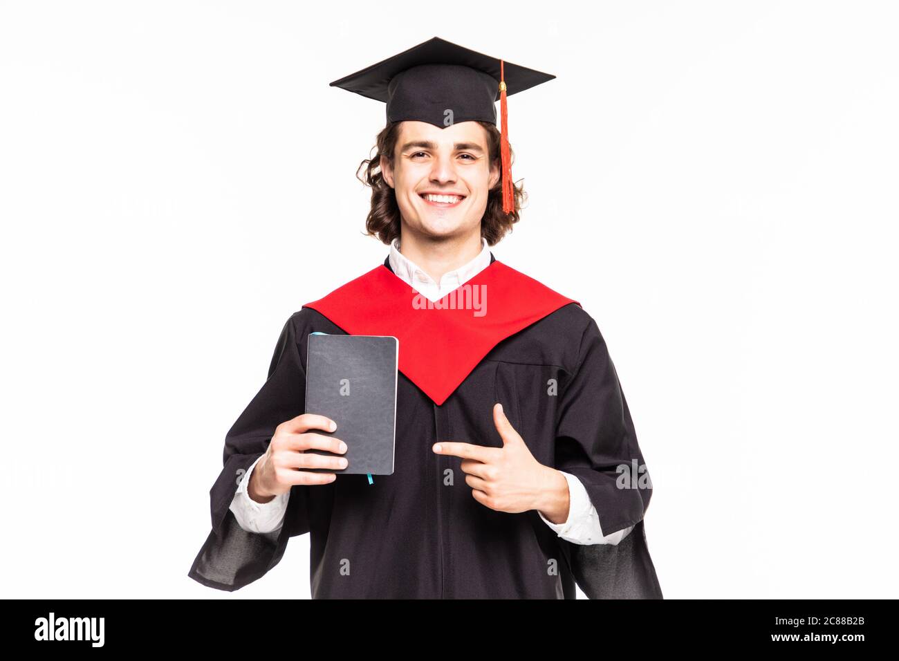 Young man with graduation cap and gown and diploma Stock Photo - Alamy